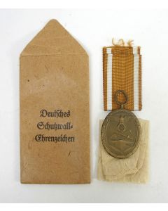  Deutsches Schutzwall-Ehrenzeichen (Westwall-Medaille), 1939, in zakje van uitgifte 