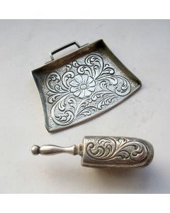 Miniatuur zilveren stoffer en blik
